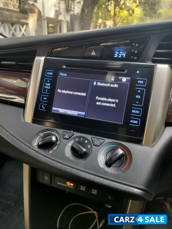 Super White Toyota Innova Crysta 2.4 G 8 Seater