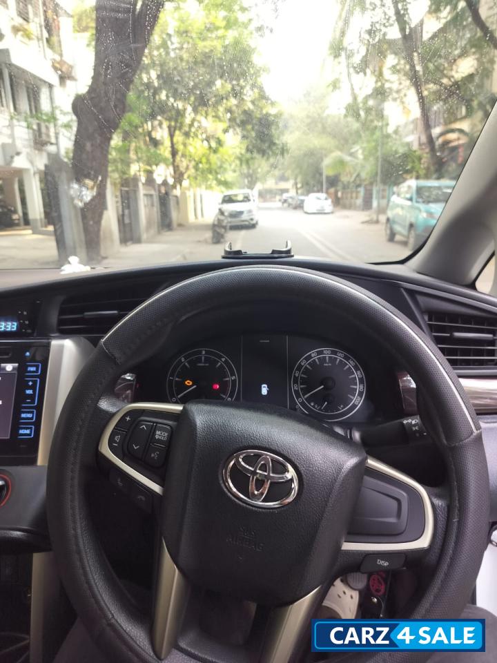 Super White Toyota Innova Crysta 2.4 G 8 Seater