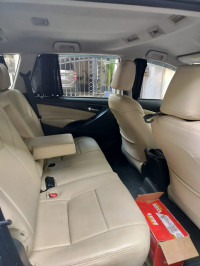 Super White Toyota Innova Crysta 2.4 G 8 Seater