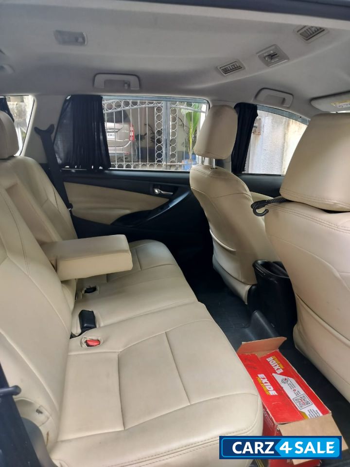 Super White Toyota Innova Crysta 2.4 G 8 Seater