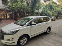 Super White Toyota Innova Crysta 2.4 G 8 Seater