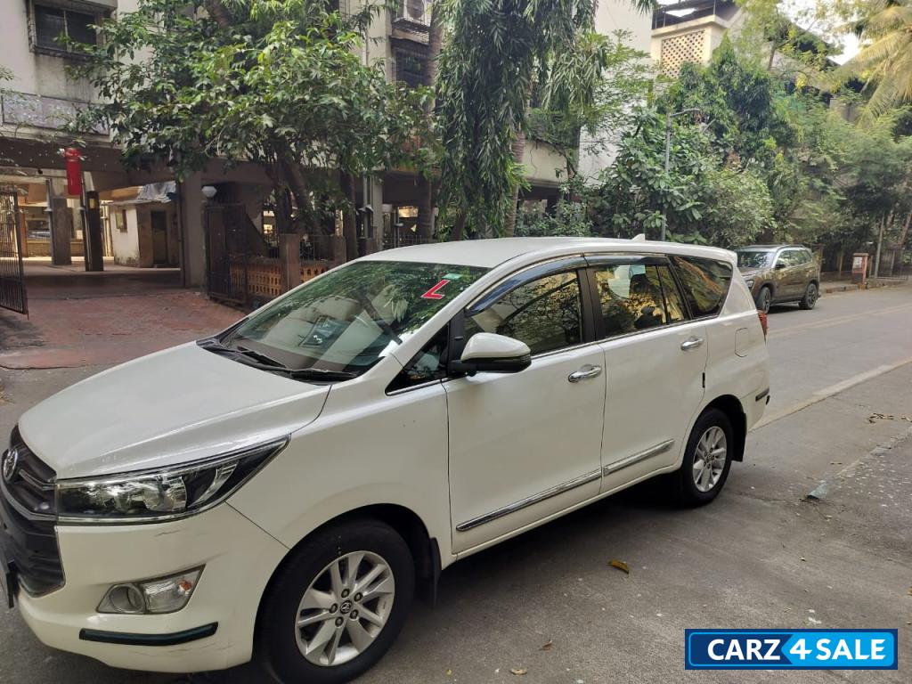 Super White Toyota Innova Crysta 2.4 G 8 Seater