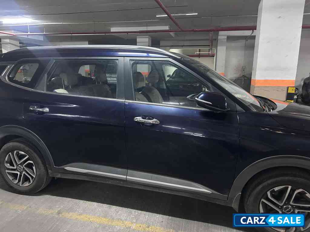 Imperial Blue Kia Carens 1.5 LUXURY AT Diesel 7 STR