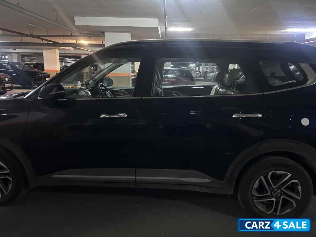 Imperial Blue Kia Carens 1.5 LUXURY AT Diesel 7 STR