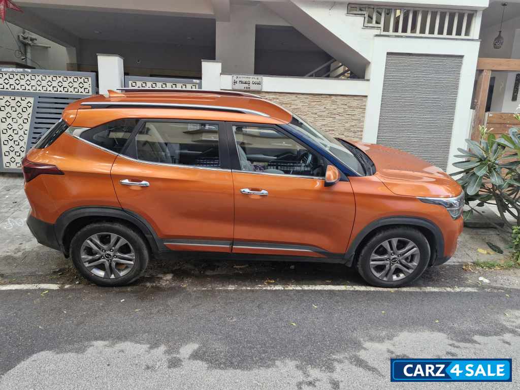 Punchy Orange Kia Seltos HTX diesel MT
