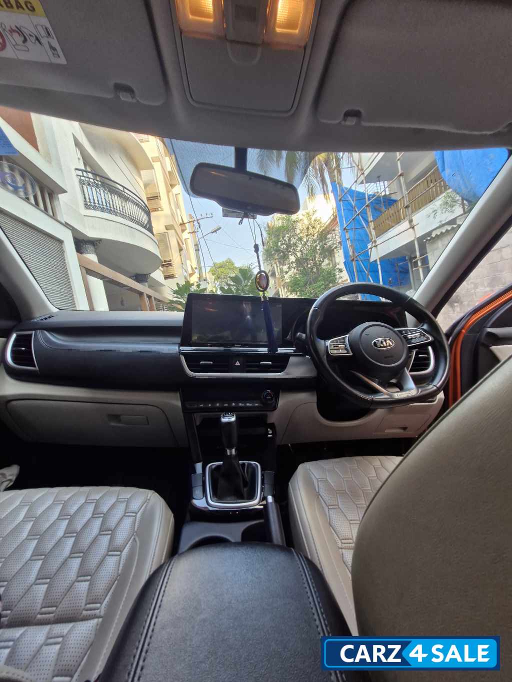 Punchy Orange Kia Seltos HTX diesel MT