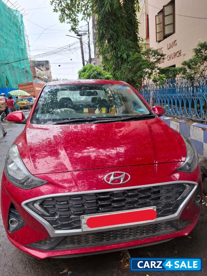 Fiery Red Hyundai Aura