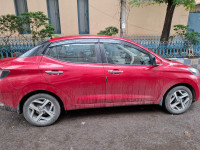 Fiery Red Hyundai Aura