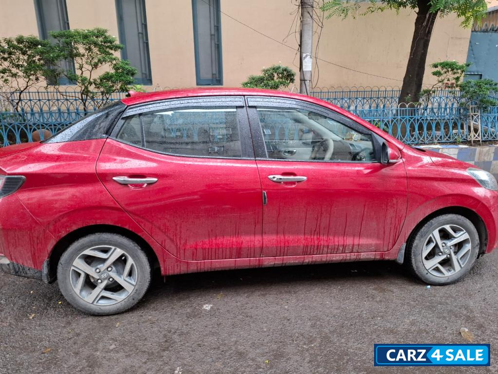 Fiery Red Hyundai Aura