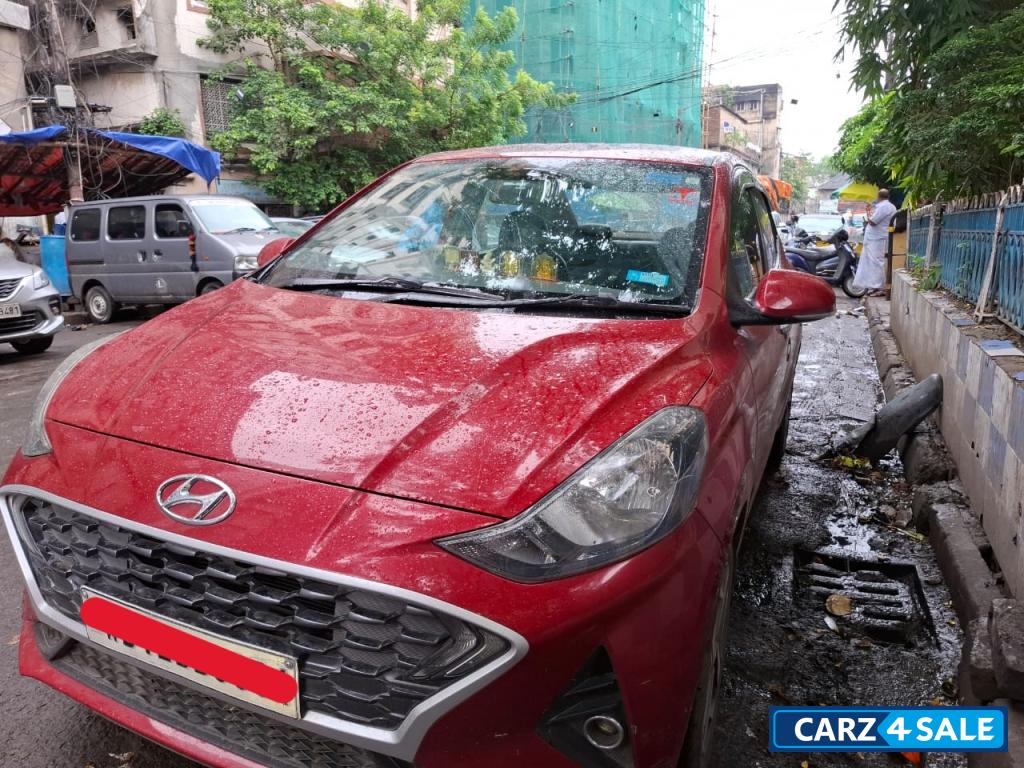 Fiery Red Hyundai Aura