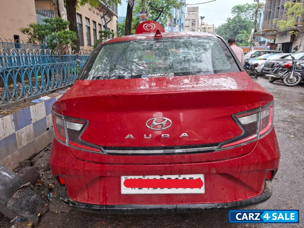 Fiery Red Hyundai Aura