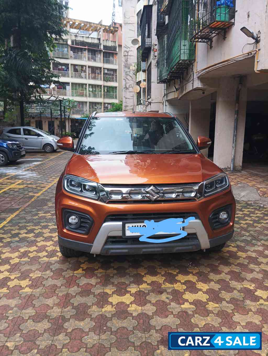 Orange Maruti Suzuki Vitara Brezza Manual