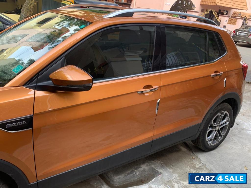 Honey Orange Skoda Kushaq Style 1.0L TSI MT