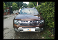 Woodland. Brown Renault Duster 110 RxZ Diesel