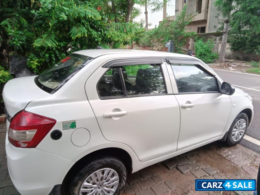 White Pearl Maruti Suzuki Dzire Tour s cng