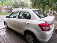 White Pearl Maruti Suzuki Dzire Tour s cng