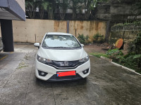 White Honda Jazz 1.2 L petrol