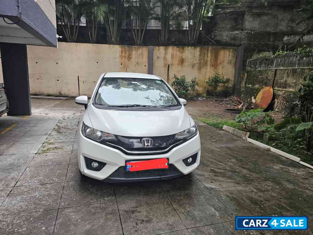 White Honda Jazz 1.2 L petrol