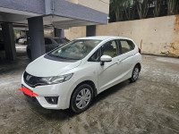 White Honda Jazz 1.2 L petrol