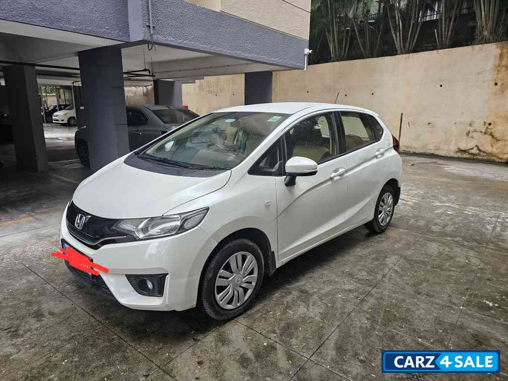 White Honda Jazz 1.2 L petrol