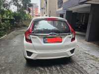 White Honda Jazz 1.2 L petrol