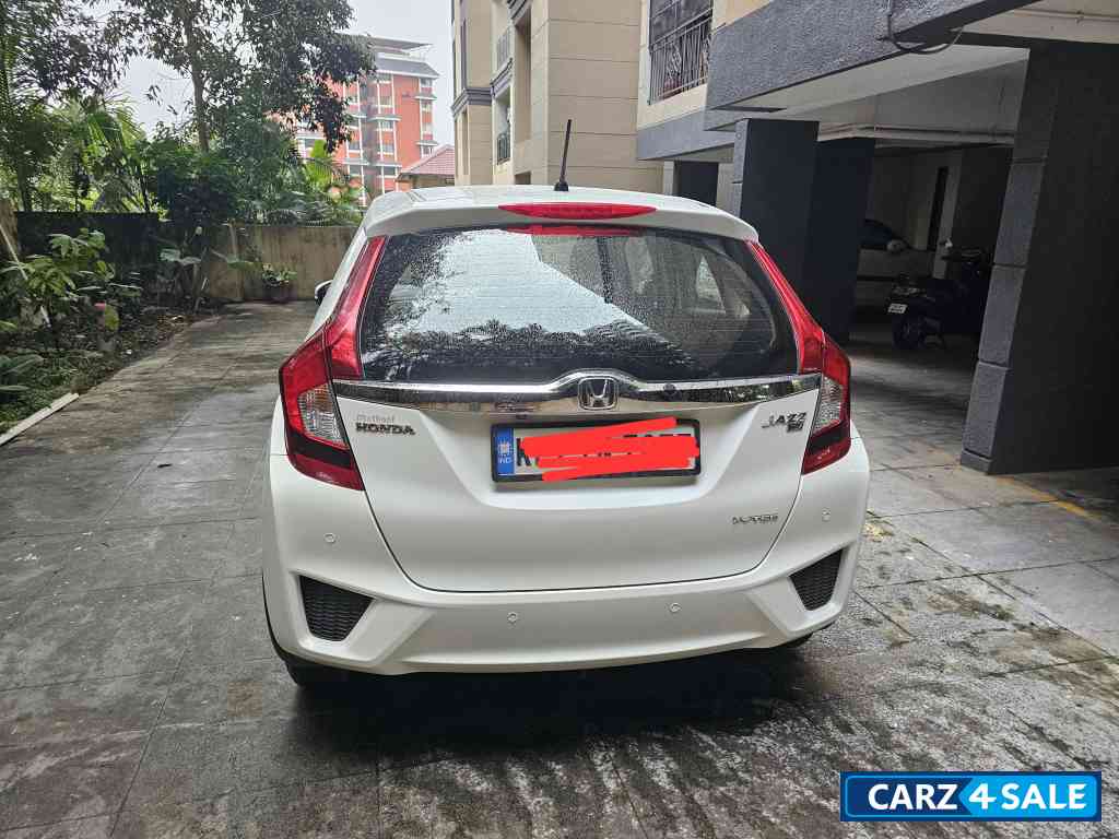 White Honda Jazz 1.2 L petrol