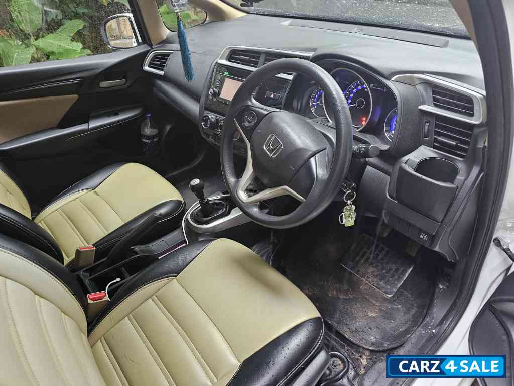 White Honda Jazz 1.2 L petrol