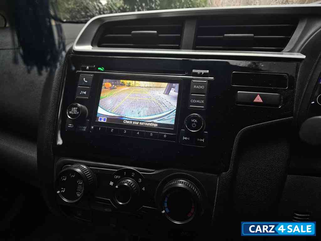 White Honda Jazz 1.2 L petrol