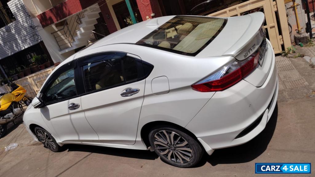 White Orchid Pearl Honda City Zx