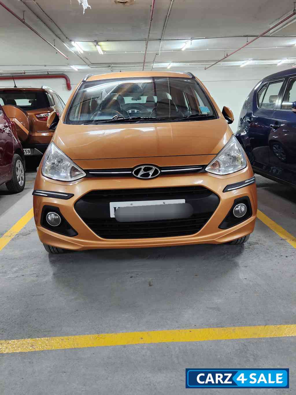 Golden Orange Hyundai  Grandi10