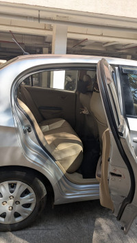 A Silver Honda Amaze S IV tec