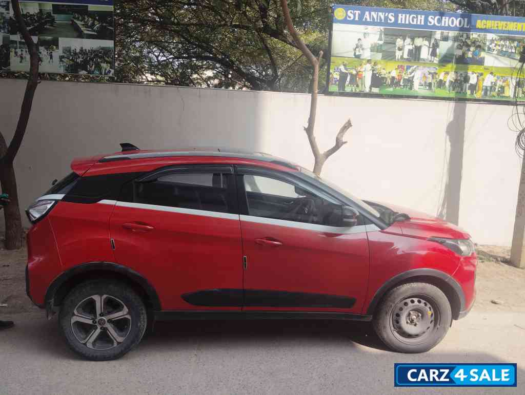 Orange Red Tata Nexon Xz plus