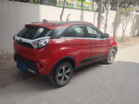 Orange Red Tata Nexon Xz plus