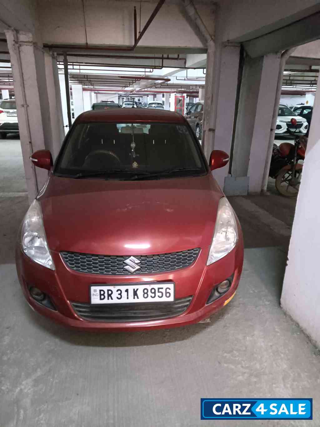 Blazed Red Maruti Suzuki Swift VXI