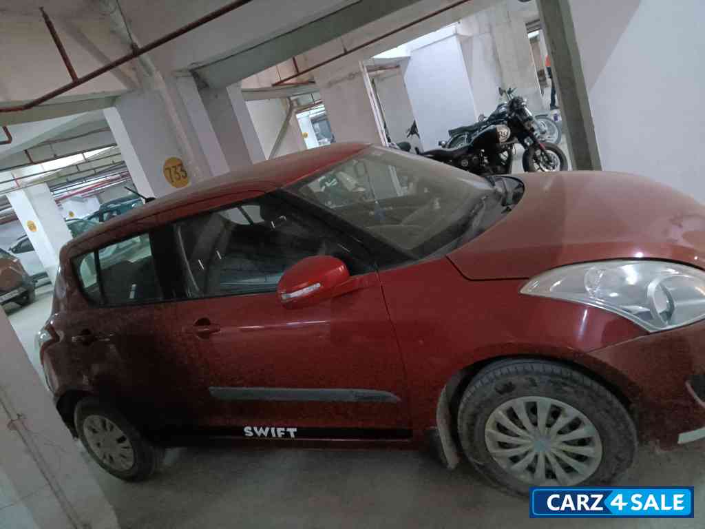 Blazed Red Maruti Suzuki Swift VXI