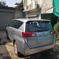 Silver Toyota Innova Crysta 2.4 G 8 STR