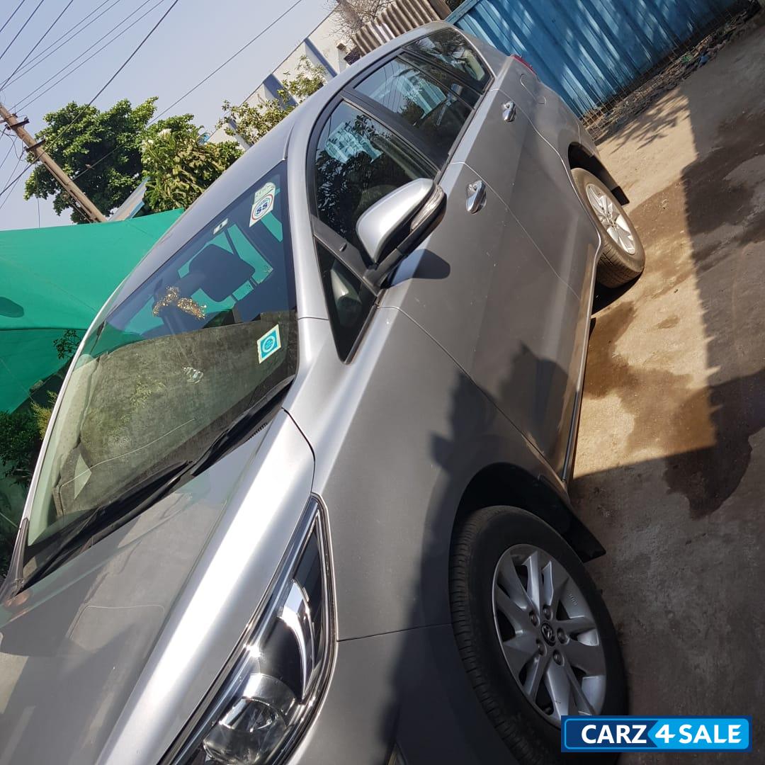 Silver Toyota Innova Crysta 2.4 G 8 STR