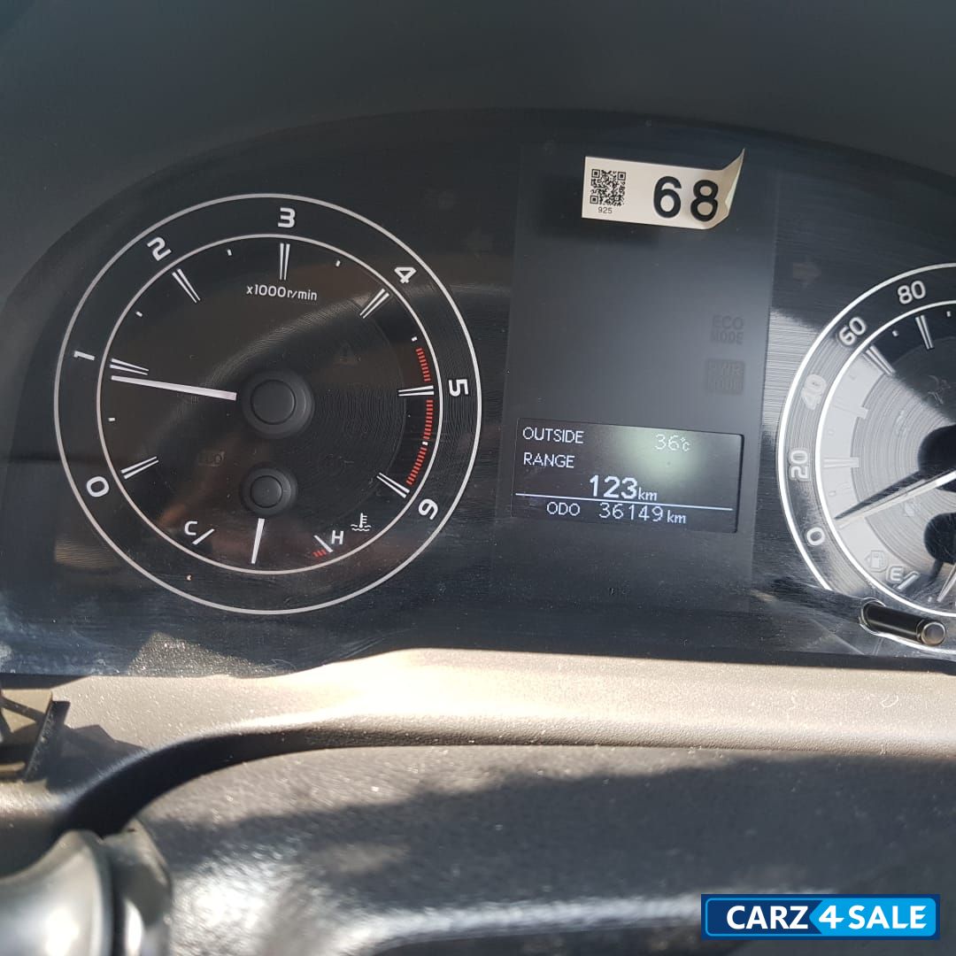 Silver Toyota Innova Crysta 2.4 G 8 STR