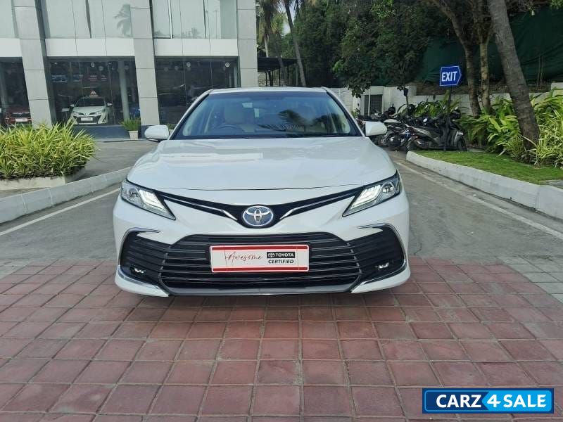 White Toyota Camry Hybrid