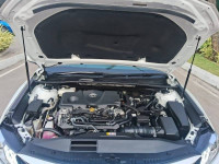 White Toyota Camry Hybrid