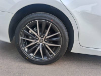 White Toyota Camry Hybrid