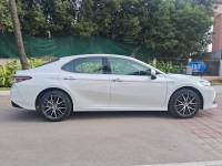 White Toyota Camry Hybrid