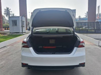 White Toyota Camry Hybrid