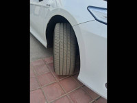 White Toyota Camry Hybrid