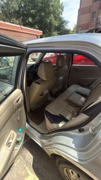 Silver Maruti Suzuki Dzire LXI O