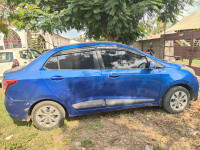 Blue Hyundai Xcent Base 1.2