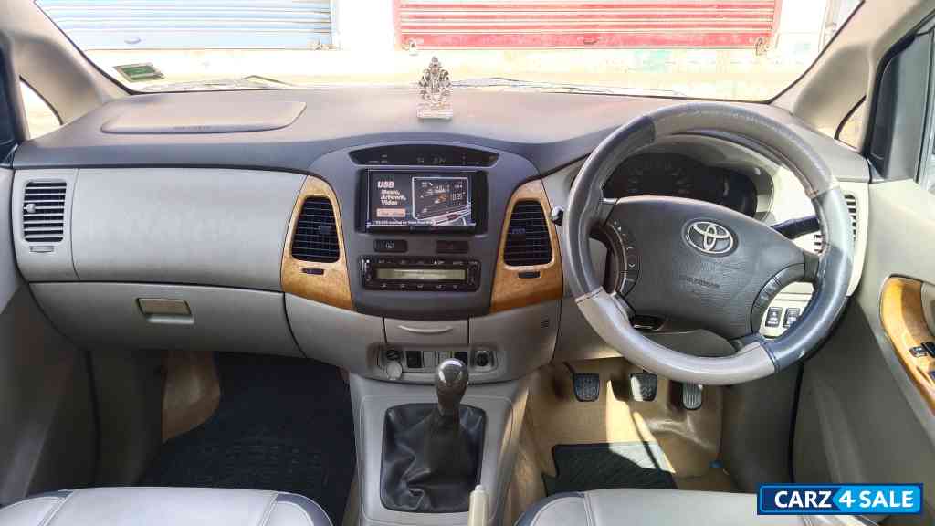 Grey Toyota Innova 2011