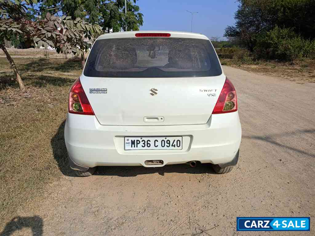 White Maruti Suzuki Swift VXI White Maruti Suzuki Swift VXI