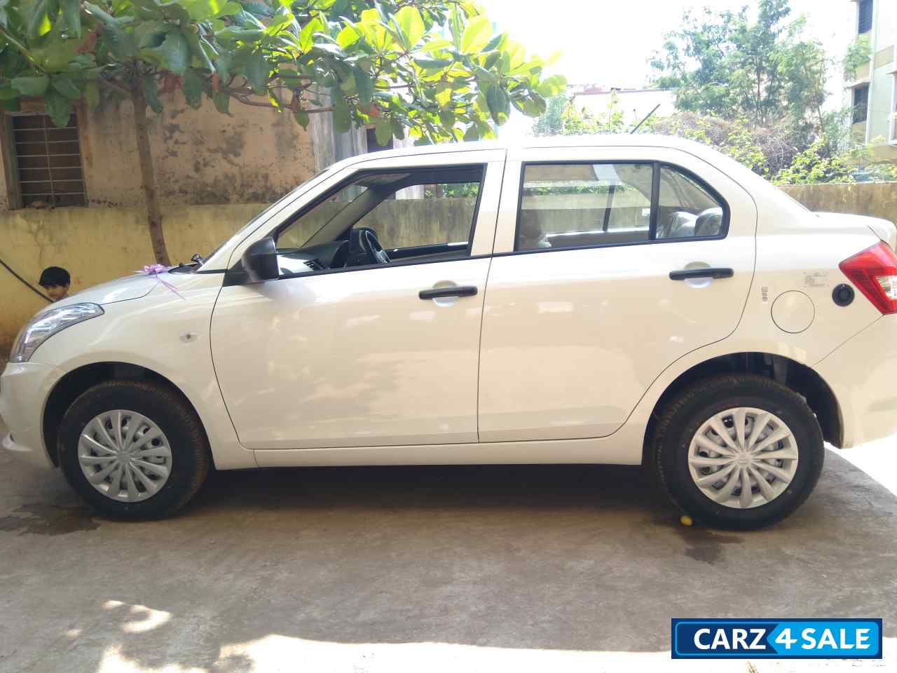 Pearl White Maruti Suzuki Swift DZire