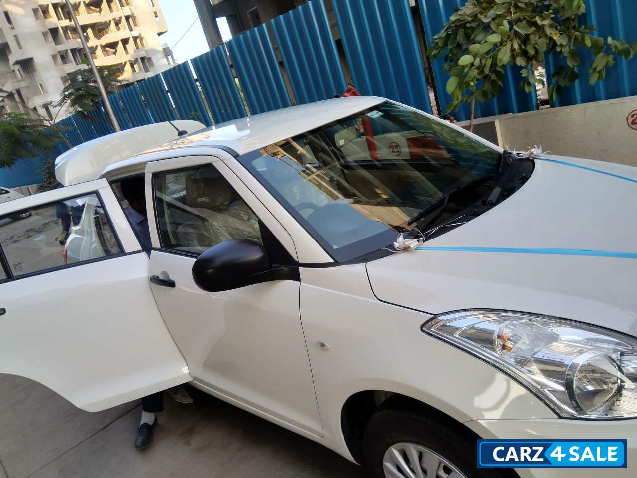 Pearl White Maruti Suzuki Swift DZire